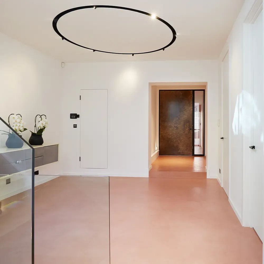 An entrance hall with a seamless microcement floor
