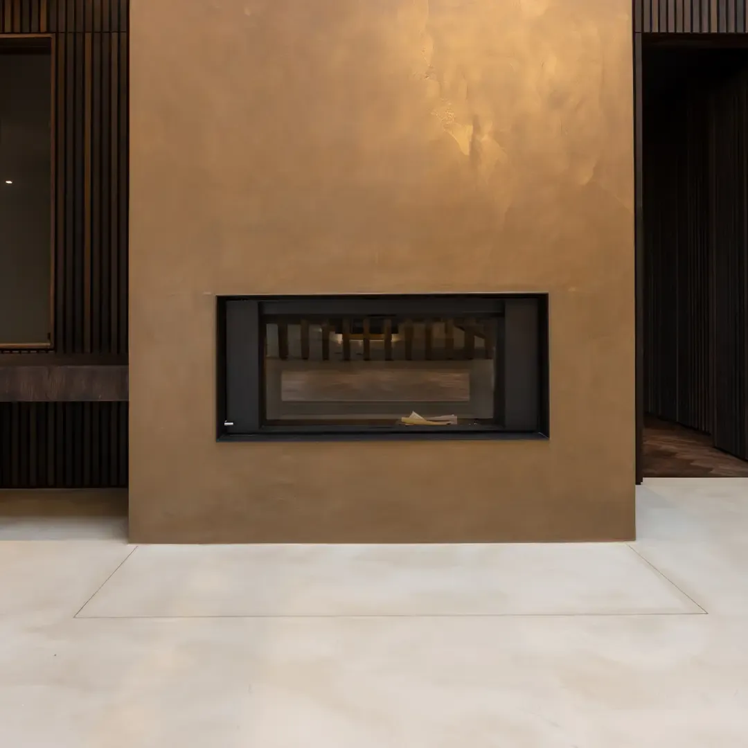 A fireplace front finished in Real Metals®