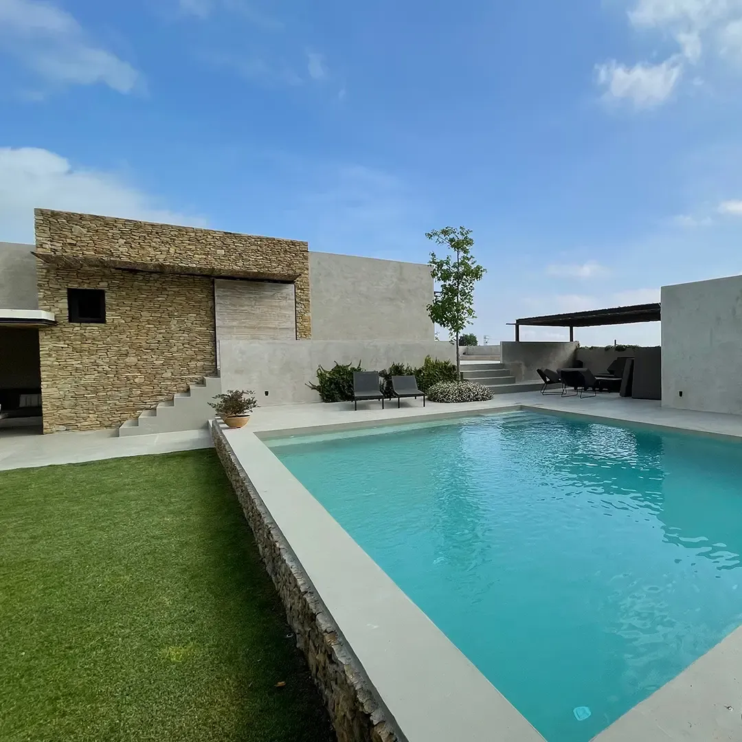 A pool and sun terrace lined with T/Swim®