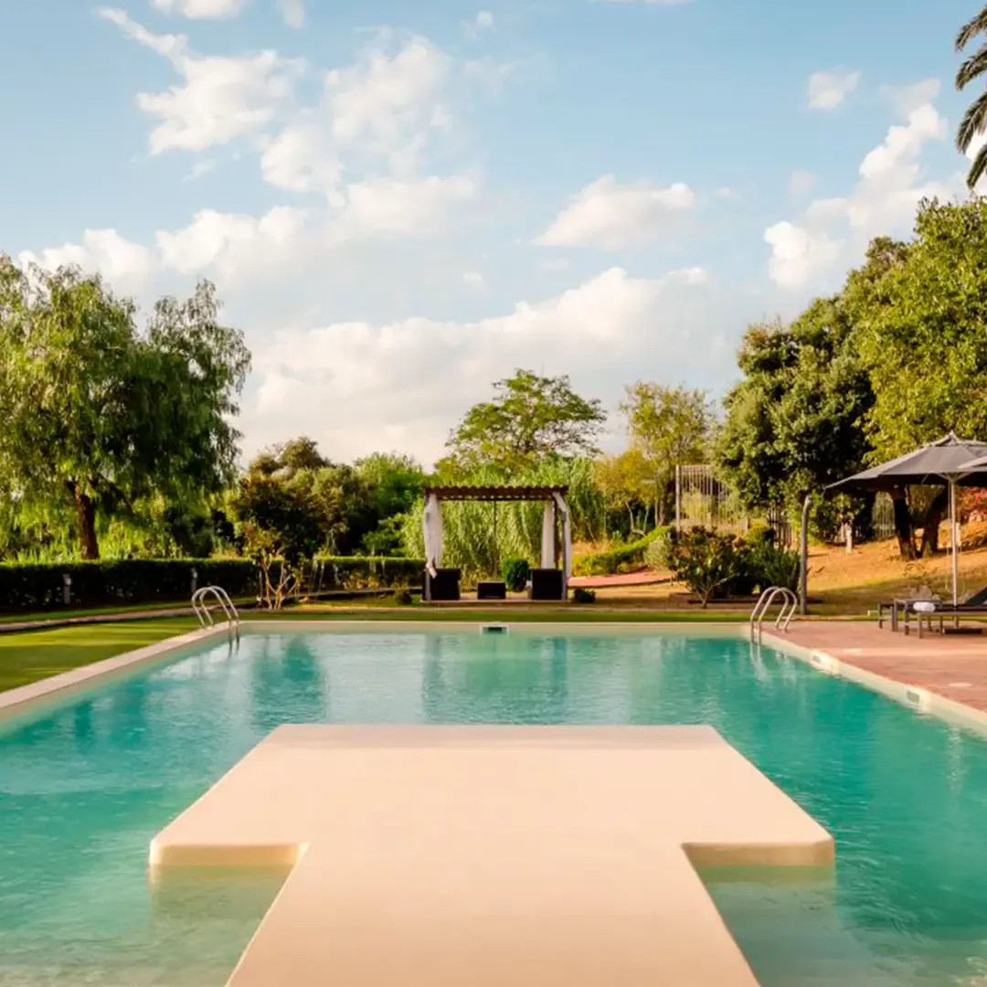 A pool with an access platform, lined with T/Swim®